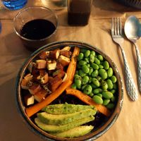 Black rice bowl with tofu, edamame, avocado and carrots at Riz Riz - Marais in Paris