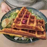 A sweet potato waffle with guacamole, pomegranate pits and salad at Riz Riz - Marais in Paris