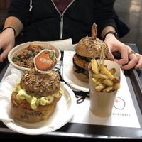 Vegan burger and salad bowl (back) veggie burger and vegan chips (front) at Veg&Veg in Rome