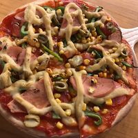 the vegan ham and cheese and green olive pizza - great  at The Fisherman Vegan Restaurant   in Hoi An