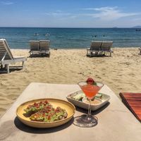 Food brought to us on the beach - Simmer Time cocktail, avocado toast and spring roll at The Fisherman Vegan Restaurant   in Hoi An