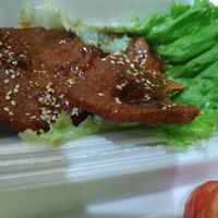 Pork with lemongrass, 3 thin slices and one lettuce leaf at Phong Nha Vegan in Phong Nha