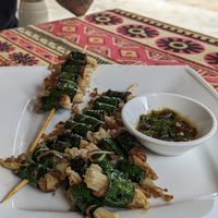 Beef and enoki skewers wrapped in lolot leaf at Phong Nha Vegan in Phong Nha