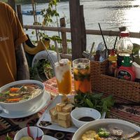 Thick noodle and vegetable soup, fried tofu, iced kumquat green tea, iced mango and coconut smoothie at Phong Nha Vegan in Phong Nha