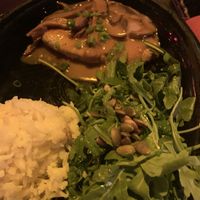 Chick’n in shitake gravy with rice and arugula salad  at Hula's Island Grill in Santa Cruz