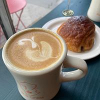 Latte with oat milk and vegan pain au chocolate   at Old Crow Coffee Co. & Moodswing Coffee in New Westminster
