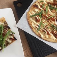 A slice of Pesto CBR and Stranger Wings. Both good! at Virtuous Pie - UBC in Vancouver