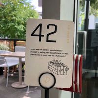 A gentle nudge for the non-veggie patrons to consider veganism...whilst they await the food with the highest likelihood of achieving that goal. at Virtuous Pie - UBC in Vancouver