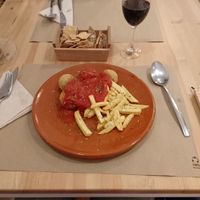 Albóndigas de soja en salsa de tomates y patatas fritas at Bar Ecologico Gaia in Sevilla
