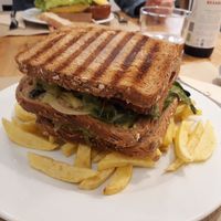Triple sandwich. Loved the chips, salad and vegan cheese. Not so keen on the tempeh. at Bar Ecologico Gaia in Sevilla