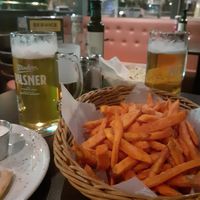 Great sweet potato fries and house lager. at O'Learys - Sollentuna in Sollentuna