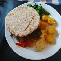 vegan burger with patatas, padrones, coleslaw and pepper at El Estragon Vegetariano in Madrid