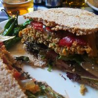 vegan burger with patatas, padrones, coleslaw and pepper at El Estragon Vegetariano in Madrid