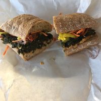 Winter Veggie sandwich. Vegan. Smashed chickpeas with Mattawoman Farms sautéed kale, roasted tomatoes, carrots, red onion, banana peppers on rosemary ciabatta at Taste in Virginia Beach