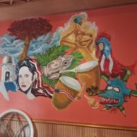 Inside wall art at Lechonera El Coqui in Jacksonville