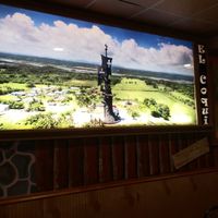 Inside wall art at Lechonera El Coqui in Jacksonville