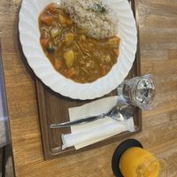 Vegetable curry and mikan juicee  at Takagiya in Tokyo