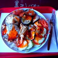 Grilled eggplant, hummus, chickpeas and salad with hot sauce at Pao Pao Queijo Queijo in Lisbon