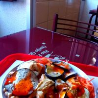 Grilled eggplant, hummus, chickpeas and salad with spicy sauce at Pao Pao Queijo Queijo in Lisbon