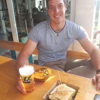 My brother just a second before all the food disappeared  at Kucha in Ljubljana