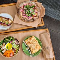 Hot dog, pizza, salad bowl and burek at Kucha in Ljubljana