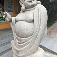 Welcoming statue at the entrance (clearly the eating is good!) at Ji Ming Temple Vegetarian Diet in Nanjing