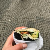 onigirazu with roasted tempeh, avo, veggies and sesame sauce at Onigirazu in Prague