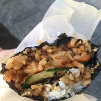 Bite through the wrap with kimchi, tofu and veg at Onigirazu in Prague