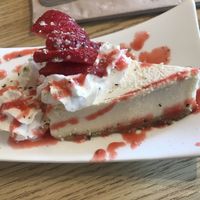 cheesecake with fresh strawberries and fresh drizzle at Love Cafe  in Oakhurst