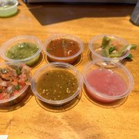 The pink salsa is  habanero and red onion. Red onion was bad and made it bitter   at Salsa's Taqueria in Folsom