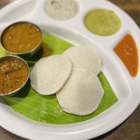 “3 idlis” - served with chutneys and sambar  at Hotel Saravana Bhavan - Connaught Circus in New Delhi