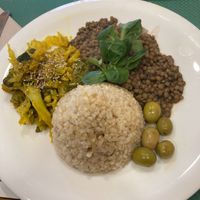 Main plate with lentils, brown rice, olives and mixed vegetables  at La Biotika in Madrid