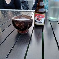Asmara beer with coconut cup at Mama Afrika in Kassel