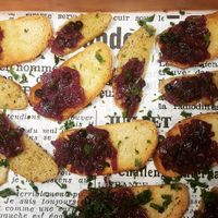 Complimentary toast with red onion and blueberry jam. at Matrjoska Kroshka in Budapest