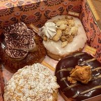 4 donuts: tiramisu, apple pie, peanut butter fudge & bienenstich at Brammibal's Donuts - Prenzlauer Berg in Berlin