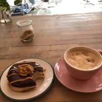 Peanut Fudge Donut and Cappucino  at Brammibal's Donuts - Prenzlauer Berg in Berlin