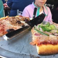 Vegan half and half thin crust pizza with Daiya, various veggies, and amazing vegan Italian sausage at Pi Pizzeria - Downtown in St Louis