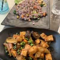 Stir fried tofu with mushrooms and basil, with olive fried rice. Delicious!! at Bali Thai - Resorts World Sentosa in Central Singapore