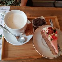 Banana bread and hot chocolate with soy milk at Puss and Books in Bruges