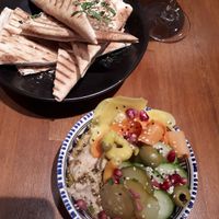Pickles, hummus and pita at Falla in Warsaw