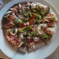 Wood-roasted vegetable pizza on whole wheat with vegan cheese at Brixx Wood Fired Pizza in Virginia Beach