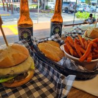 Vegan burger with vegan cheese,  potato scallops and sweet potato fries with vegan mayo at N17 Burger Co in Port Douglas