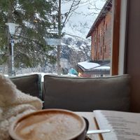 Cappuccino and a view over the mountains at Café LIV in Murren