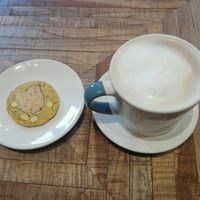 Chai latte and vegan tumeric and goji berry biscuit at Octave in Montreal