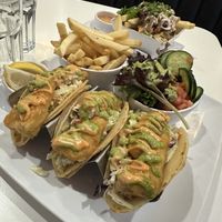 Fish tacos and loaded fried in the background  at The Modern Vegan in Las Vegas