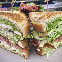 TMV CLUB
Bacon, grilled tofu, lettuce, mayo, tomato, cucumber, guac and pesto, on a triple decker stack of toasted sourdough.  at The Modern Vegan in Las Vegas
