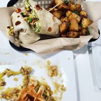 Devoured chicken and waffles next to the breakfast burrito at The Modern Vegan in Las Vegas