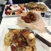 Chicken & waffles, cheddar bites, fruit platter, biscuits & gravy at The Modern Vegan in Las Vegas
