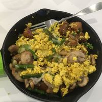 Breakfast skillet with onions, mushrooms, asparagus, potatoes, mozzarella, and tofu scramble!  at The Modern Vegan in Las Vegas