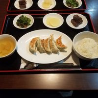 Gyoza set containing Gyozas, rice, veggi soup, pickled radish, a salad containing brokkoli and sea weed, and a five spice mochi type of thing - very yummy. at Ren - Nakagyo Ward in Kyoto
